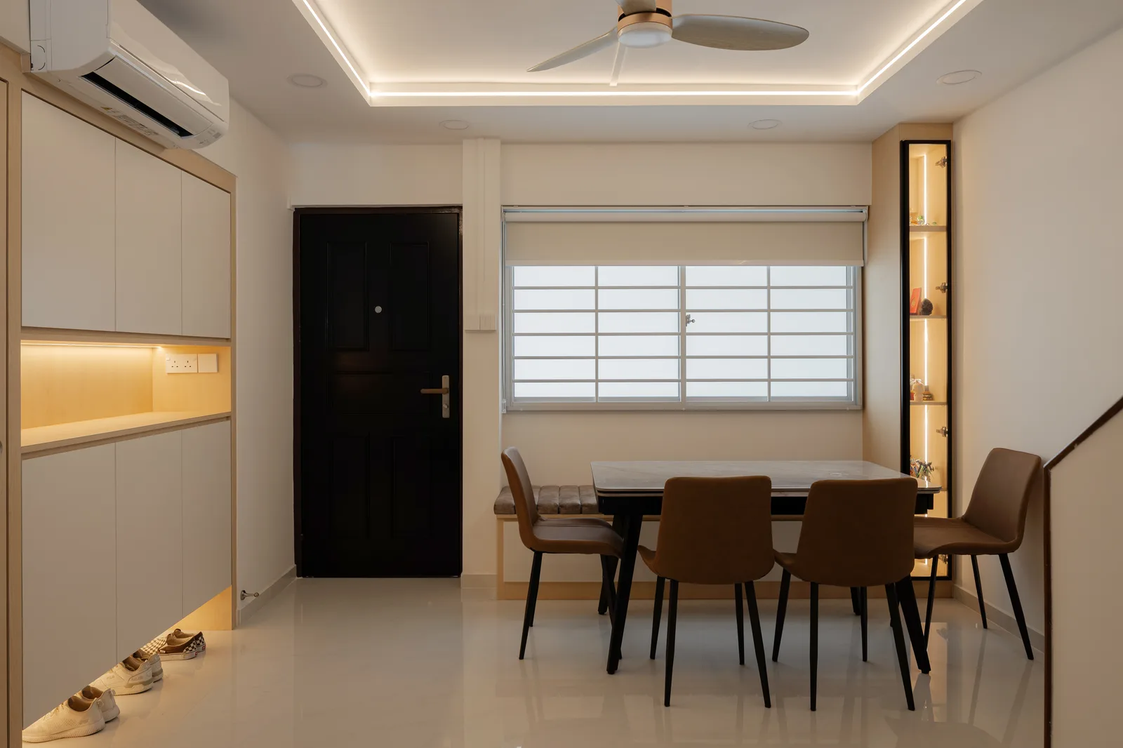 A dining room washed in warm cove light